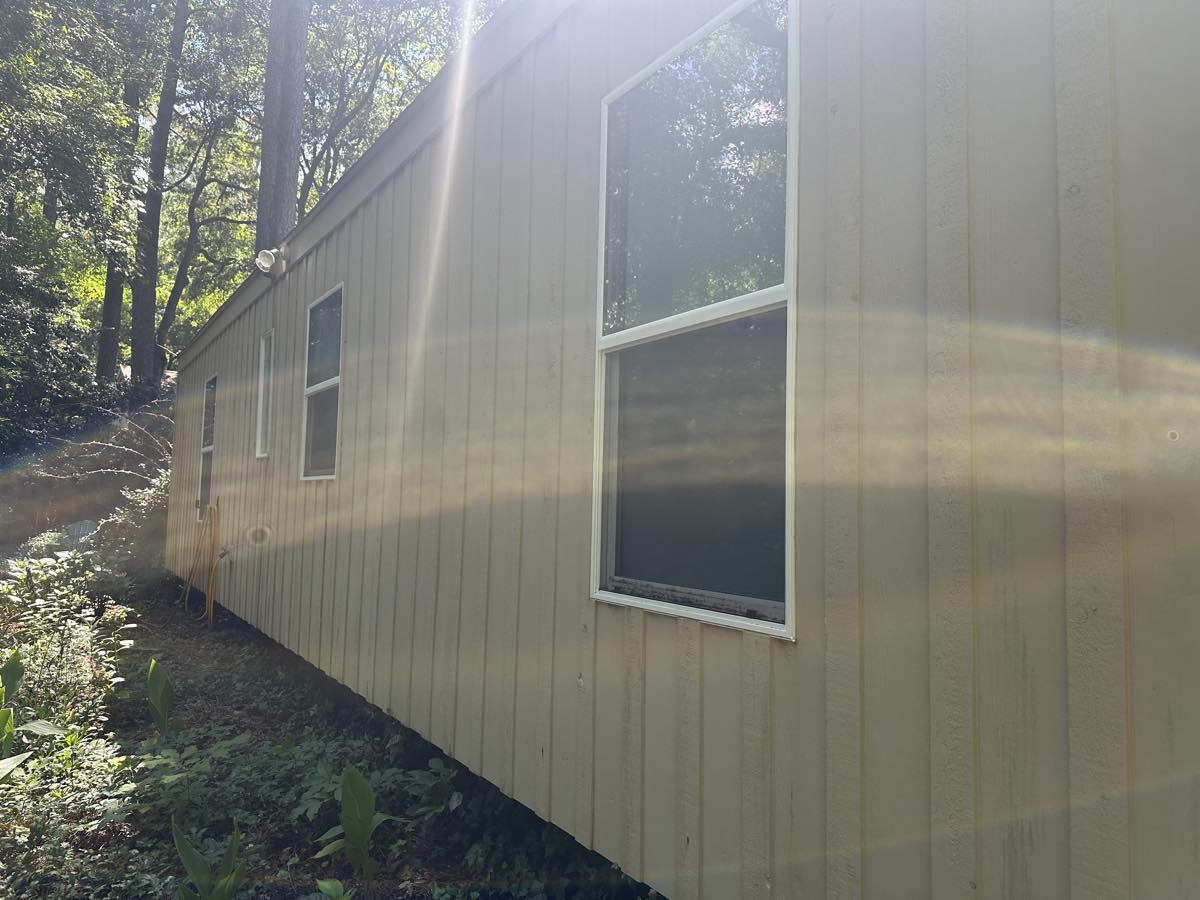 Finished siding with the growth removed